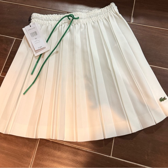 Lacoste Dresses & Skirts - Lacoste Women's Cream Pleated Skirt with Green Accent